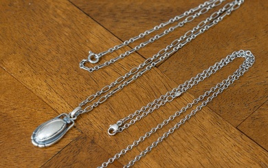 A Georg Jensen sterling silver 2009 commemorative necklace, pendant length 28mm, chain length 45cm, together with another Georg Jensen chain