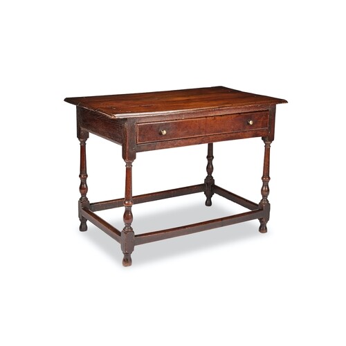 A George II oak side or writing table With moulded plank top...