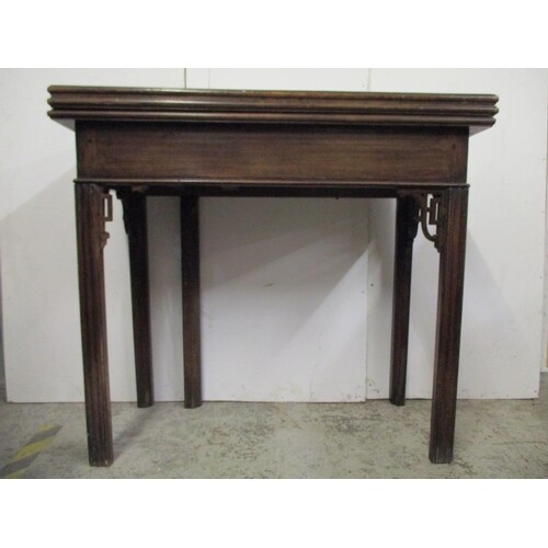 A George III Chippendale style mahogany tea/card table with ...