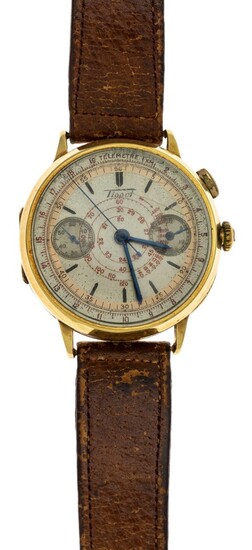 A Gold Gentleman's Chronograph Wristwatch by Tissot. 18 carat gold case with powdered copper f...