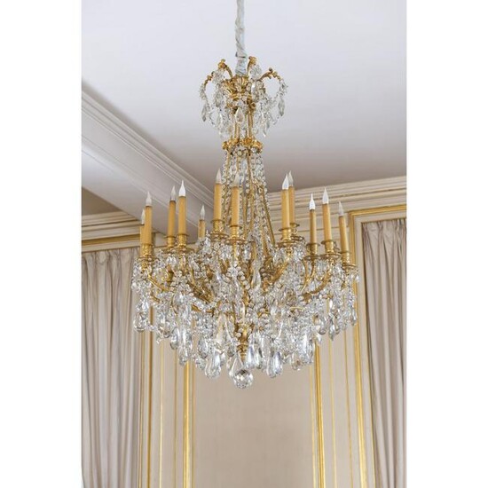 A Louis XVI style gilt metal and glass eighteen light