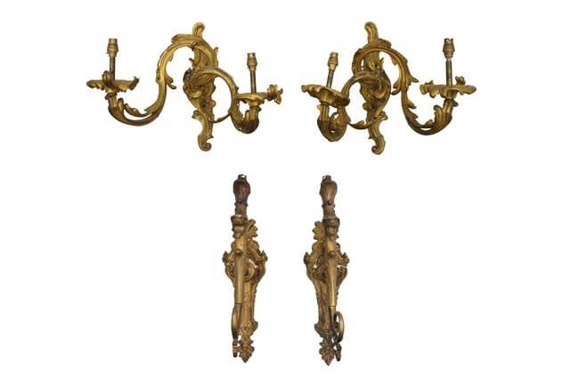 A PAIR OF GILT BRONZE ORMOLU TWIN BRANCH WALL SCONCES IN THE ROCOCO MANNER