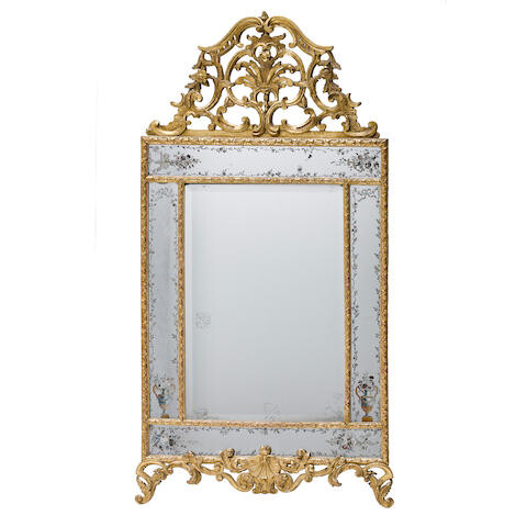 A RÉGENCE STYLE CARVED GILTWOOD MIRROR