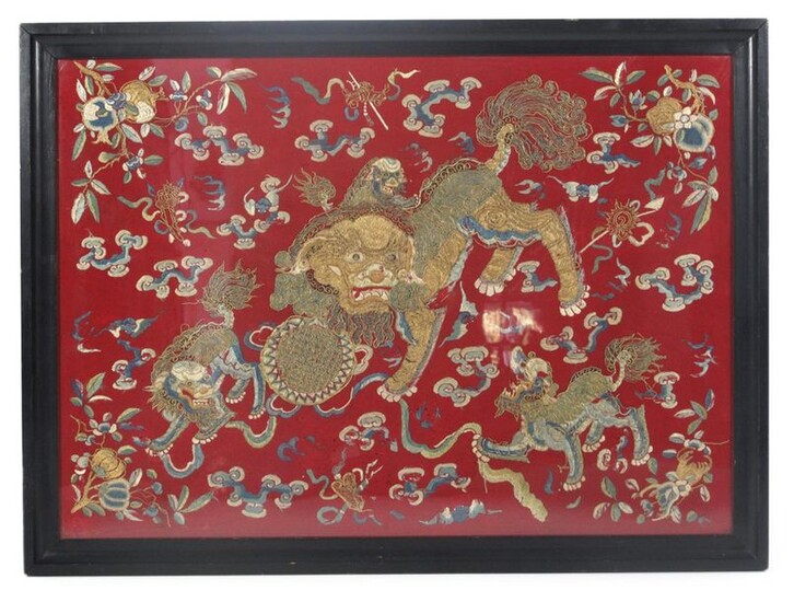 A SILK EMBROIDERY DEPICTING LIONS CHASING A BALL, China, late 19th ct. - Couched metal-wrapped threads and floss silk embroidery on red ground - 66 x 90 cm, R.