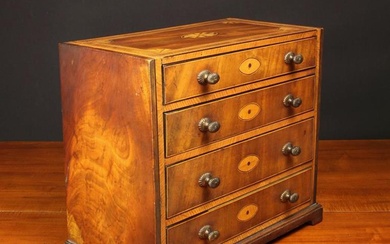 A Small Late 19th Century Inlaid Mahogany Apprentice Piece: A Chest of Drawers having four long grad
