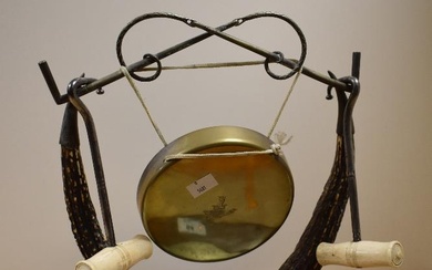 A Victorian silver plate and horn dinner gong, mounted upon an oval oak base, measuring 40cm high
