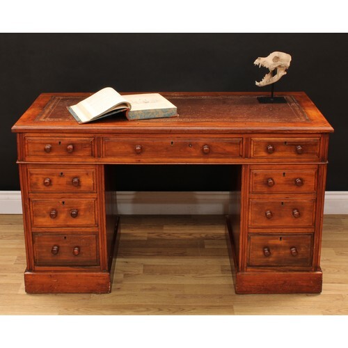 A Victorian walnut twin pedestal writing desk, moulded top w...