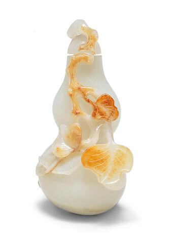 A WHITE AND RUSSET JADE 'DOUBLE-GOURD' SNUFF BOTTLE AND STOPPER