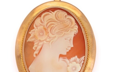 SOLD. A cameo brooch/pendant set with a cameo of carved shell, mounted in 14k gold....