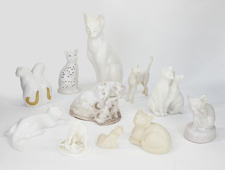A collection of white glazed pottery cats, 20th century, to include a Bing & Grondahl group, 22cm high, a Noritake group, 12cm high, and other white or cream glazed cats, tallest 38.5cm high (11)