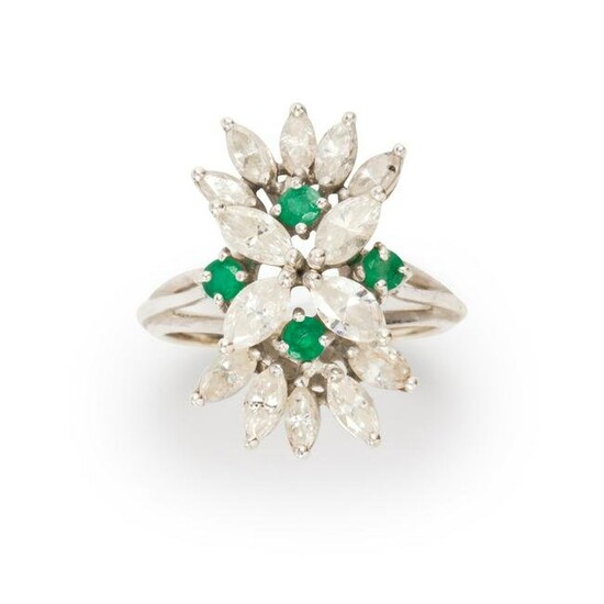 A diamond, emerald and fourteen karat white gold ring