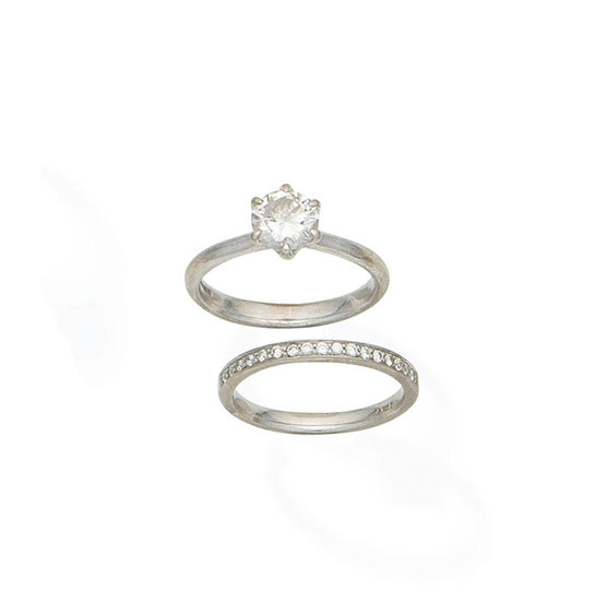 A diamond single-stone ring and a diamond half eternity ring