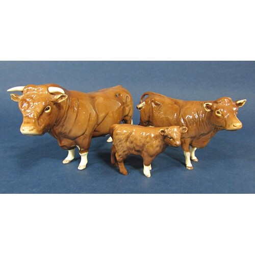 A family of three Beswick Limousin cattle comprising bull, c...