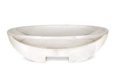 A large contemporary silver centrepiece dish by Asprey, London, 2008, of oval form, the plain body raised on a longitudinal curving foot to flat base designed with rectangular cut-out, 41.5cm long, 30.5cm wide, 12.8cm high