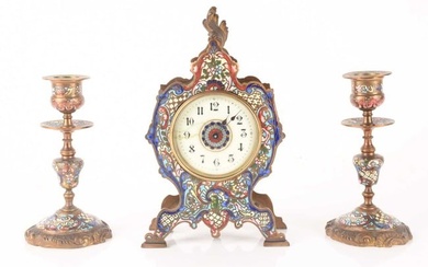 A late 19th-century French champléve enamel mantle clock with matching candlesticks, clock meas