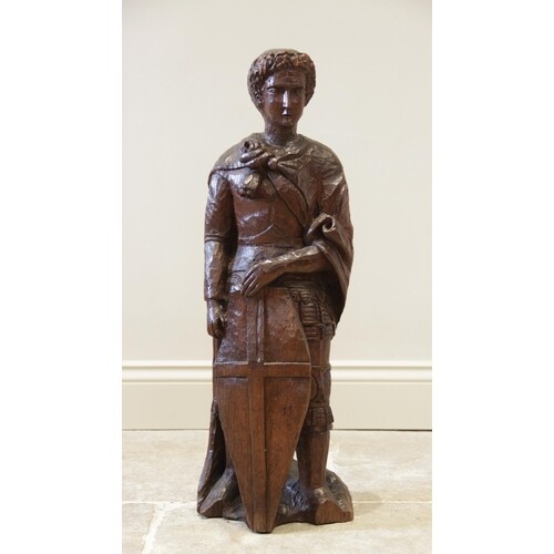 A late 19th century carved oak figure of St George, after Do...