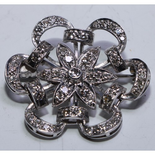 A late Victorian/Edwardian diamond floral ribbon brooch, cen...
