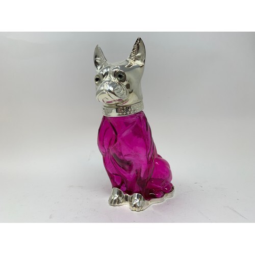 A novelty glass decanter in the form of a dog, with plated m...