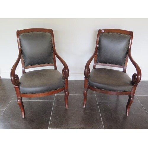 A pair of 19th French mahogany fauteuils scroll arm open arm...