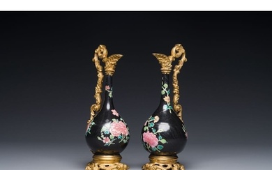 A pair of Chinese black-ground famille rose vases with gilt ...