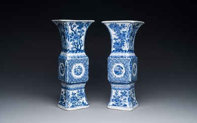 A pair of Chinese blue and white 'gu' vases with floral design, Kangxi