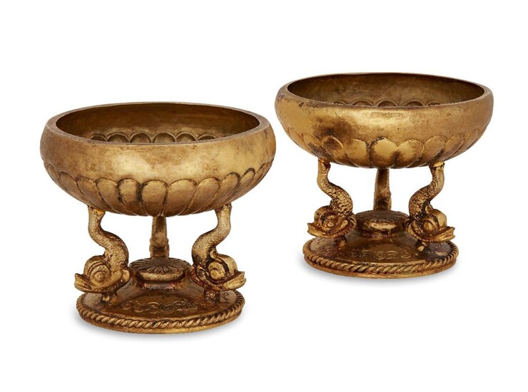 A pair of Greek silver-gilt salts, first half 20th century, each with dolphin supports, stamped in Greek and 925, 6cm high (2)