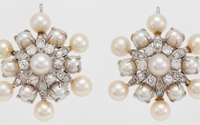 A pair of diamond and cultured pearl earrings, each of flower head design set with brilliant- and single-cut diamonds and cultured pearls, clip fittings