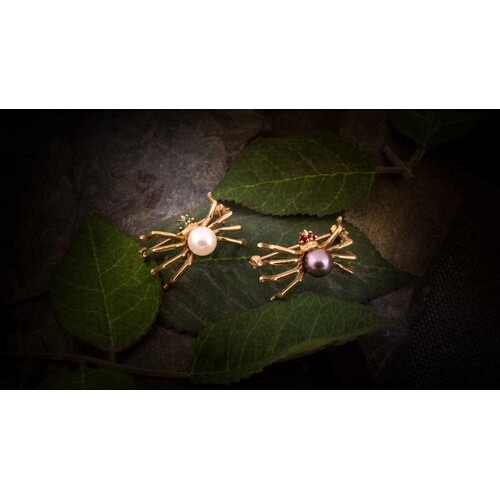 A pair of pearl spider brooches, the first being set with a ...