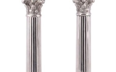 A pair of silver coloured metal columnar table lamps