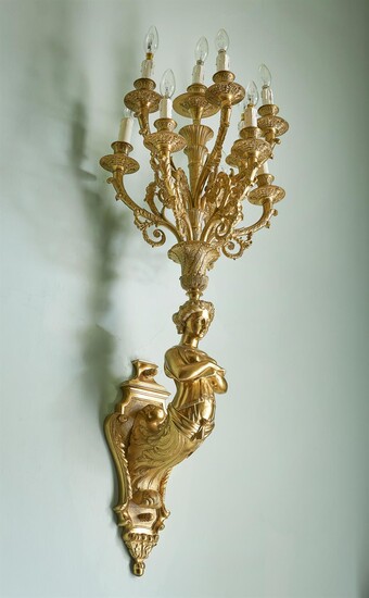A pair of substantial French gilt-metal ten light wall appliques in Empire style