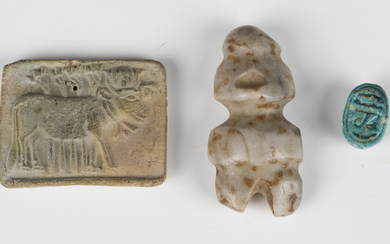 A pre-Columbian Guerrero stone carved figural amulet, length 5.2cm, together with a clay tablet, pro
