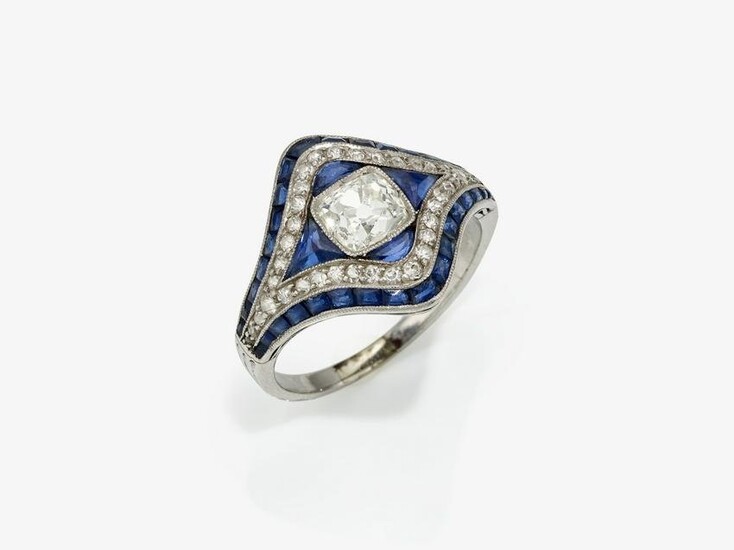 A ring with a Peruzzi cut diamond and sapphires