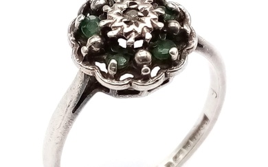 A vintage 14K white gold Emerald and Diamond floral cluster ...