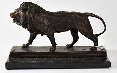 AFTER ANTOINE-LOUIS BARYE (1795-1875); a bronze figure of a lion,...