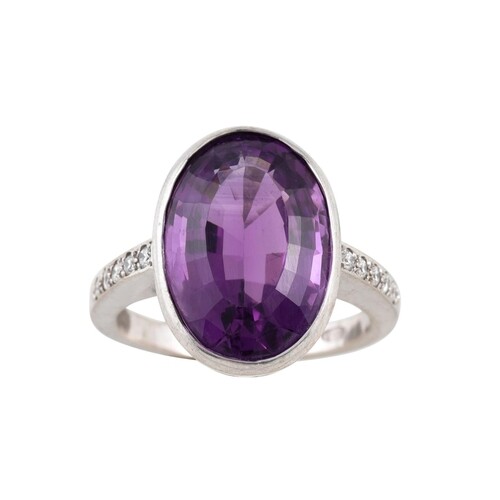 AN AMETHYST RING, the oval amethyst to diamond shoulders, mo...