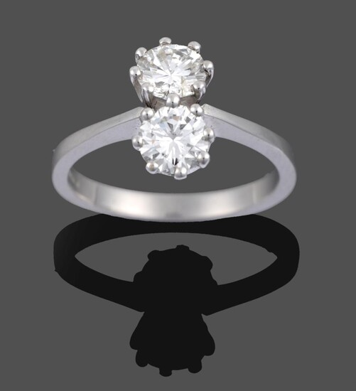 An 18 Carat White Gold Diamond Two Stone Ring, the round brilliant cut diamonds in claw...