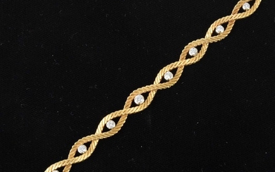 An 18 carat yellow gold bracelet set with eleven diamonds.