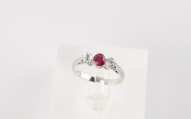 An 18ct white gold ruby & diamond three stone ring, the roun...