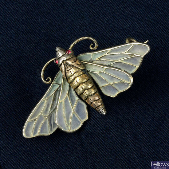 An Art Nouveau early 20th century silver and plique-à-jour enamel moth brooch.