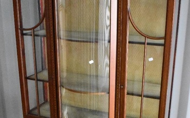 An Edwardian mahogany display cabinet with inlaid decoration, on square tapered legs with spade