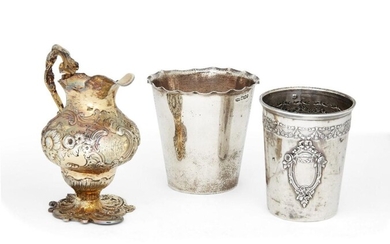 An Edwardian silver beaker with crimped rim, Sheffield, c.1900, Mappin & Webb, together with a French beaker with Minerva mark for 800 silver, the base stamped C Faure F and the cylindrical body repousse decorated with garland band to...