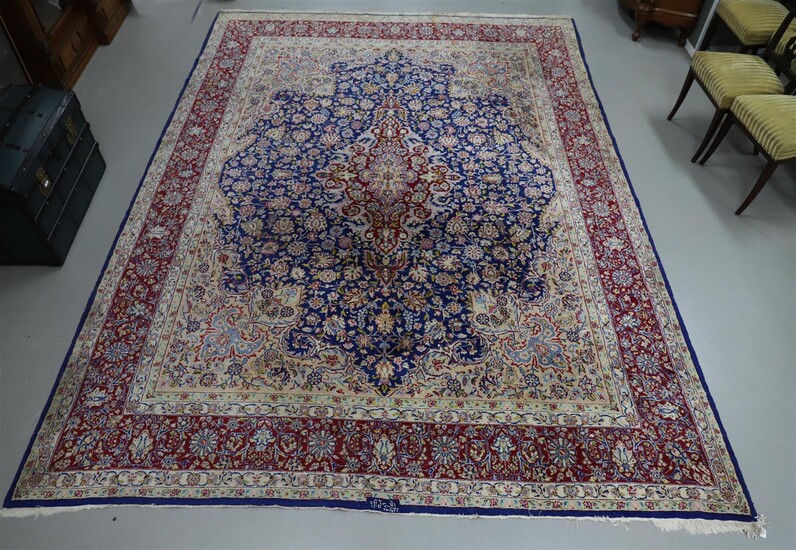 (-), An oriental carpet, signed, 20th century, l...