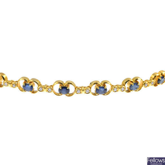 An oval-shape sapphire and brilliant-cut diamond bracelet.