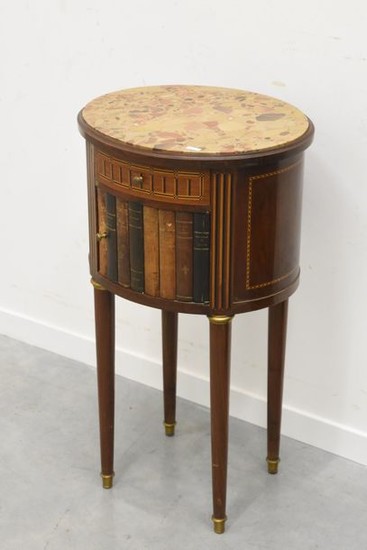Bedside table with marble top, decorated with books...