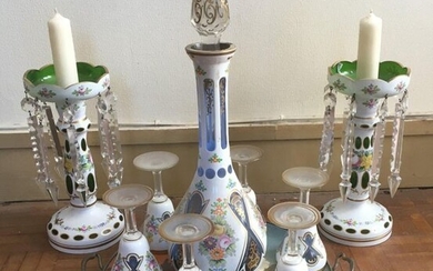 Bohemian glass set comprising a carafe, six glasses and two candleholders with white and green opaline crystal and crystal pendants decorated with garlands of flowers.