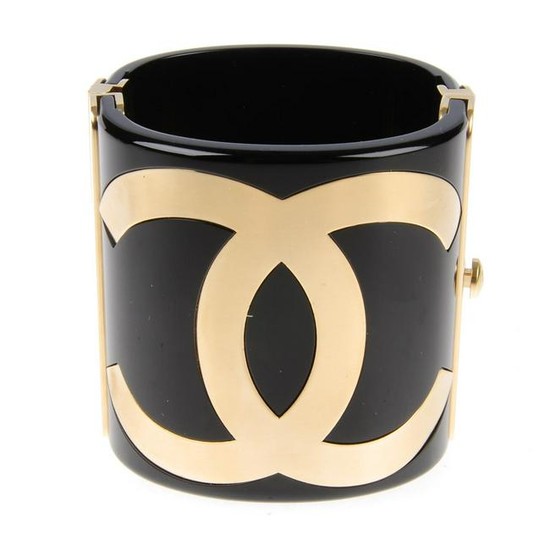 CHANEL - a black Resin CC Cuff bracelet. Crafted from