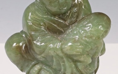 CHINESE CARVED NEPHRITE JADE FIGURE OF A BOY