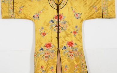 Chinese early 20th century woman's yellow silk robe with floral decoration.