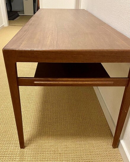 NOT SOLD. Ejvind A. Johansson: Rectangular teak coffee table with underlying shelf. H. 51 cm. L. 150 cm. W. 49 cm. – Bruun Rasmussen Auctioneers of Fine Art