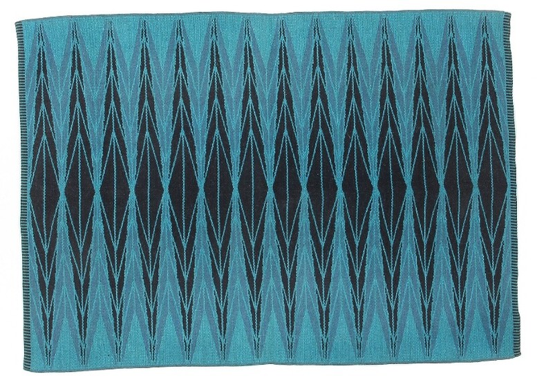 Ingrid Dessau: “Sylarna/The Awls”. Double woven wool carpet in shades of blue and turquoise. Manufactured by Kasthall, Sweden.